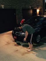 Ashley Caudle washing the teams cars!