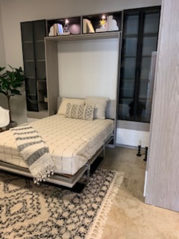 Modern Murphy Beds turn an office into that fully functioning office or den...beautiful and functional!