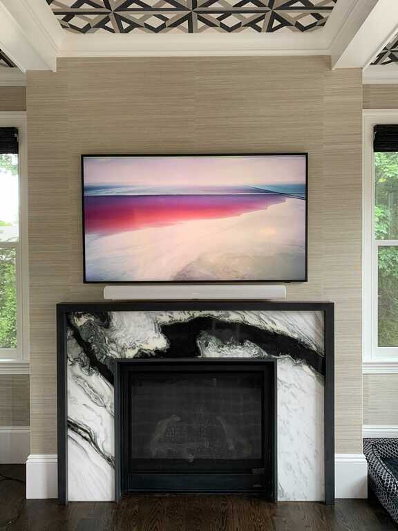 Frame TV over fireplace