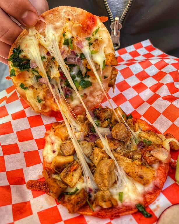 Mulita menu item cheese pull.
