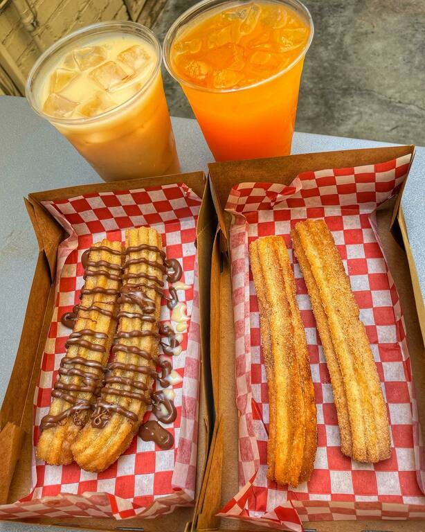 Homemade churros with toppings and various Agua Frescas menu items.
