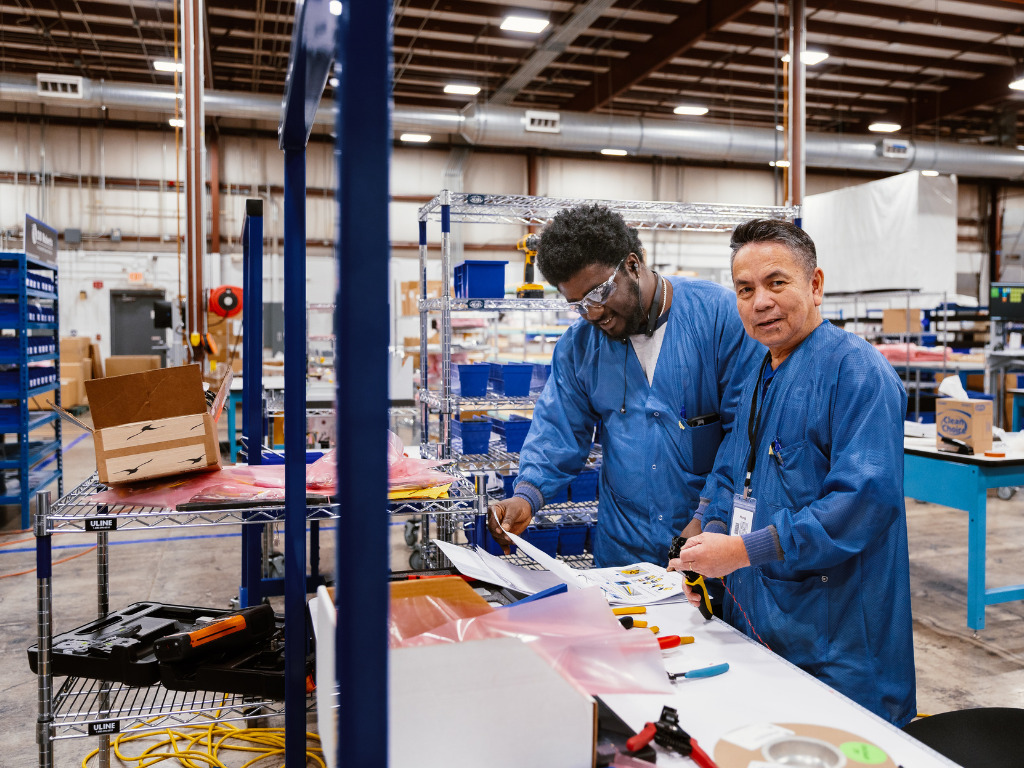 Columbia Tech workers on production floor