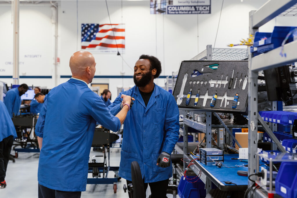 Columbia Tech workers on production floor