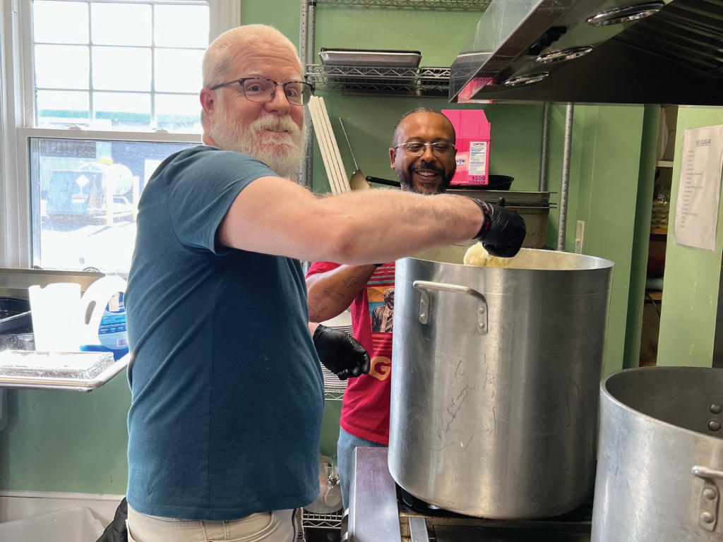 Ryan Carter and Clubhouse Member Greg work in the kitchen preparing delicious food served to our members every day.