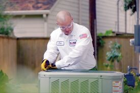 Tech working outside on AC Unit