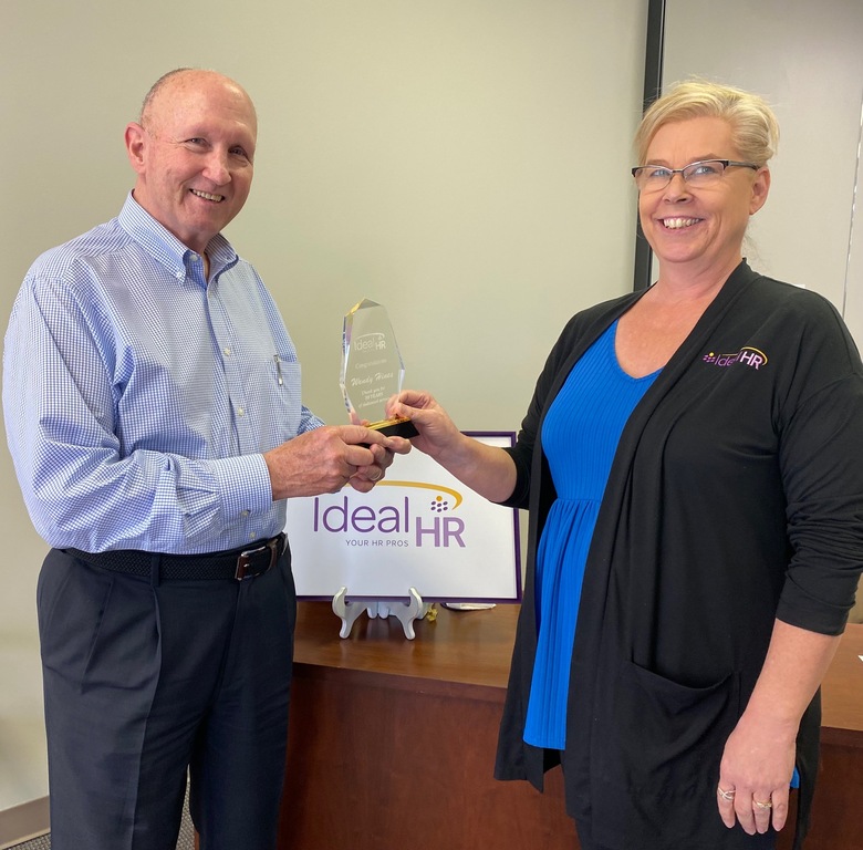 Steve presenting Ms. Wendy with her10 year award.