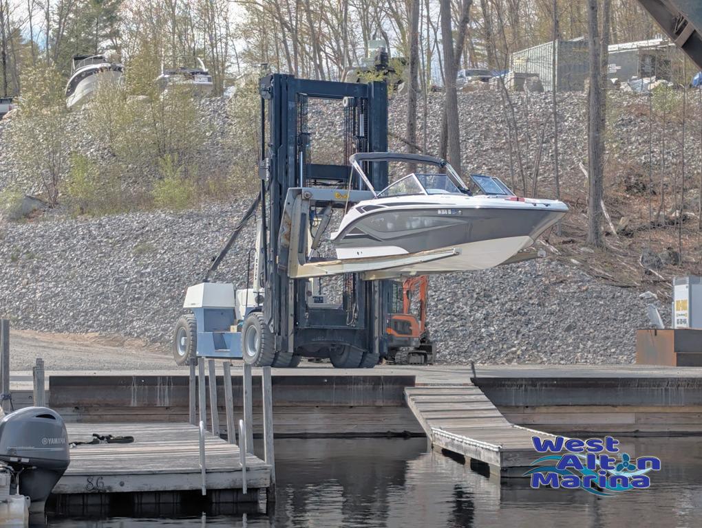 "Great Blue", our Wiggins Marina Bull, prepares to splash a boat in our Service Well.