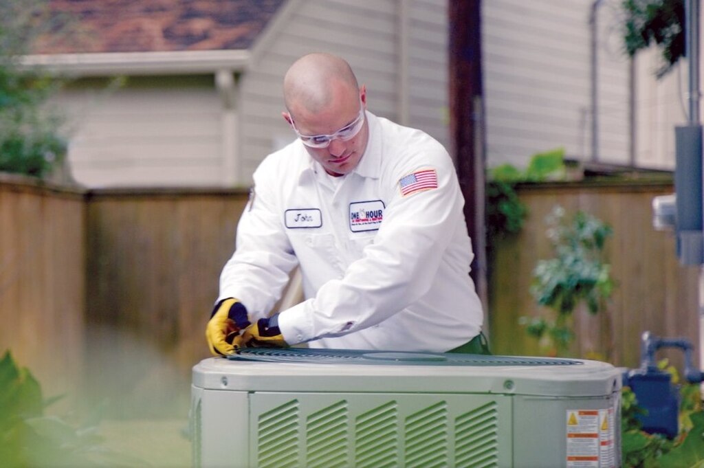 Tech working outside on AC Unit