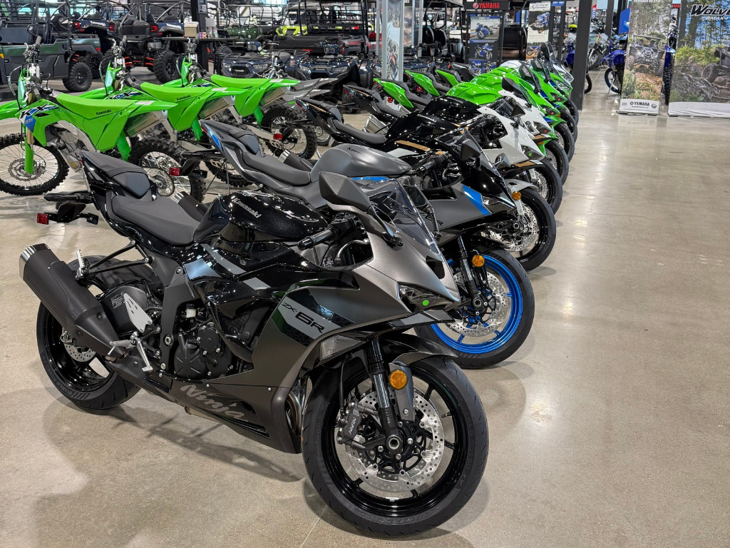 Showroom floor featuring motorcycles inside Oasis Powersports.